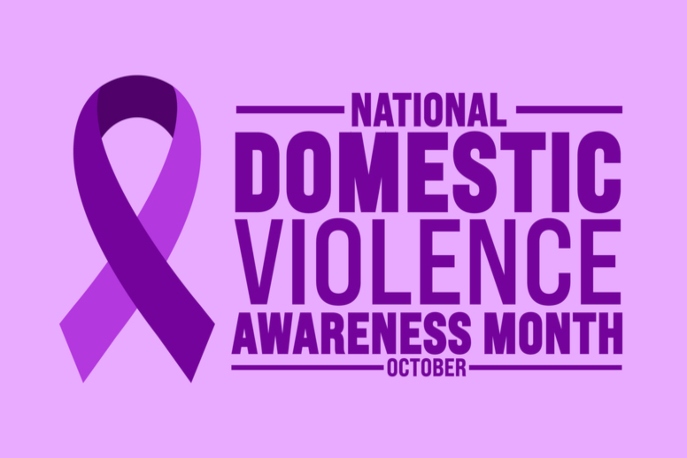 "National Domestic Violence Awareness Month, October" in dark purple against a light purple background. Purple ribbon on the side.